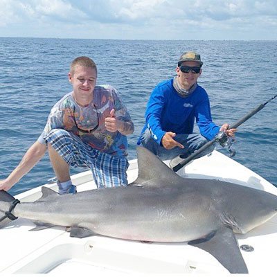 Father and Son at the Shark Fishing Charter