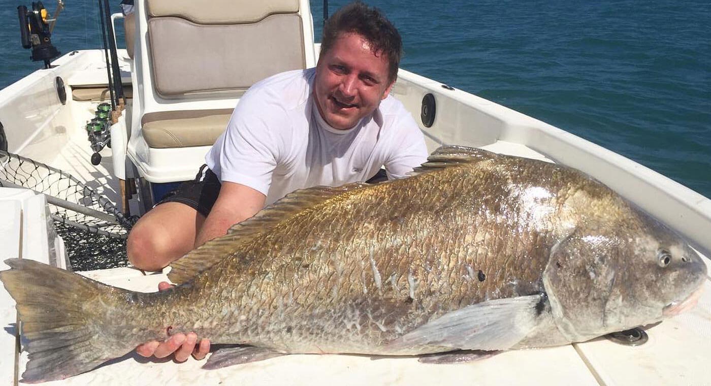 Man with black drum at the Deep Sea Fishing Charter