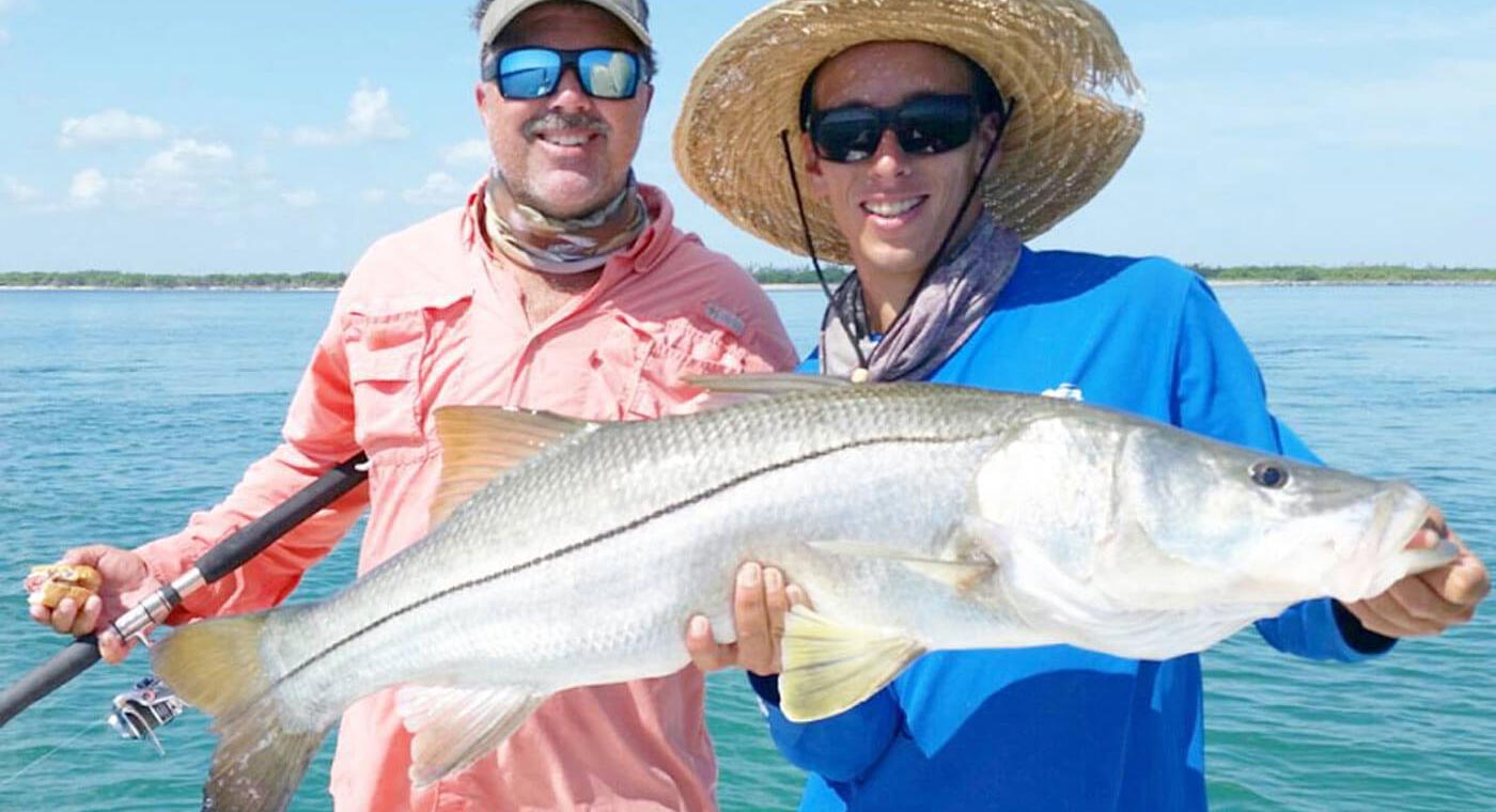 Men holding snook at the Deep Sea Fishing Charter in Cape Canaveral