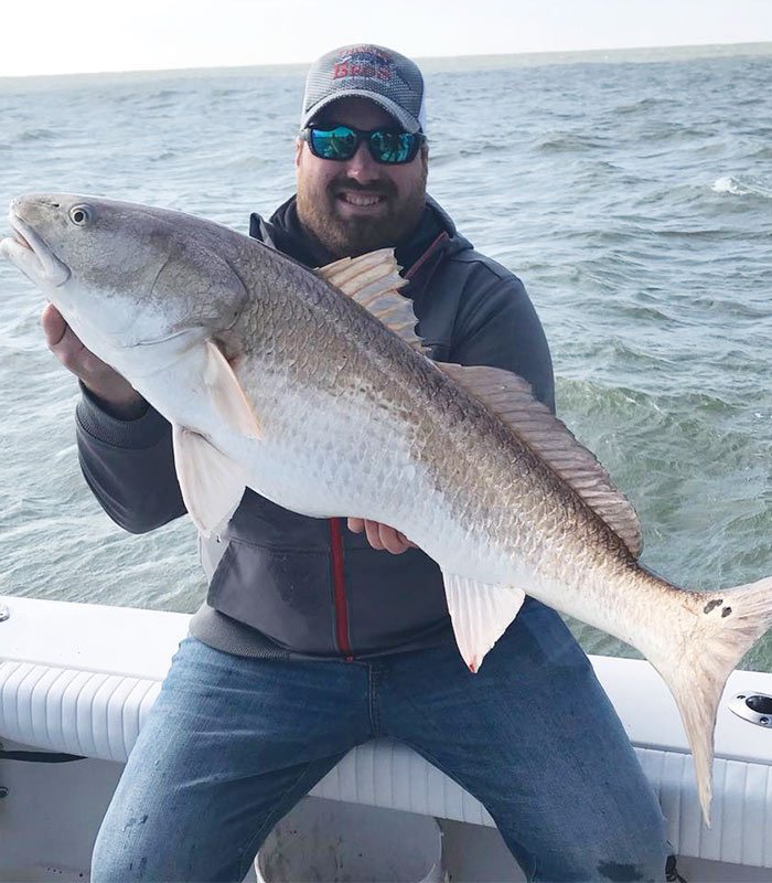 A man caught redfish in the Mosquito Lagoon