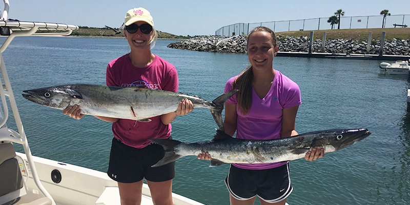 Women holding fish at the Orlando Fishing Charter